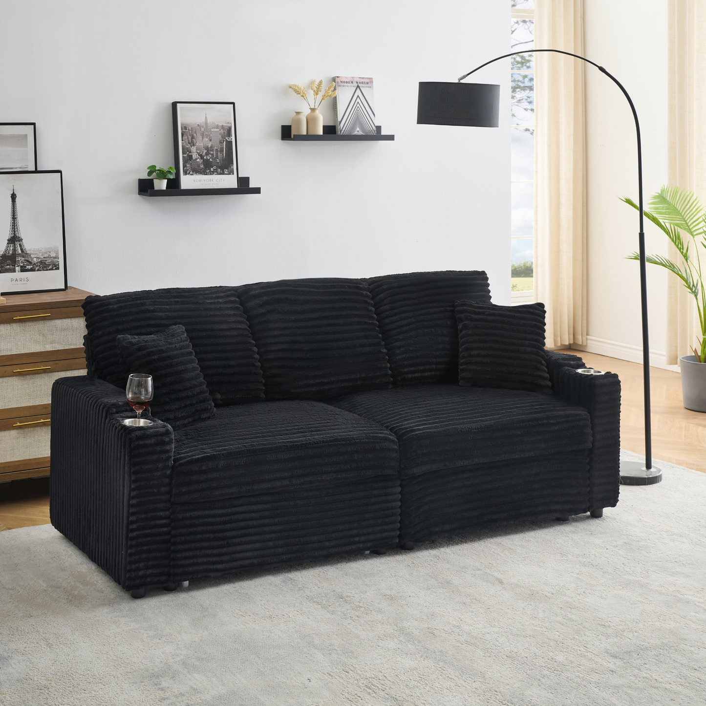 An 80-inch two-in-one pull-out, foldable and hidden chaise longue black corduroy sofa with cup holders and pillows, which is suitable for the living room.