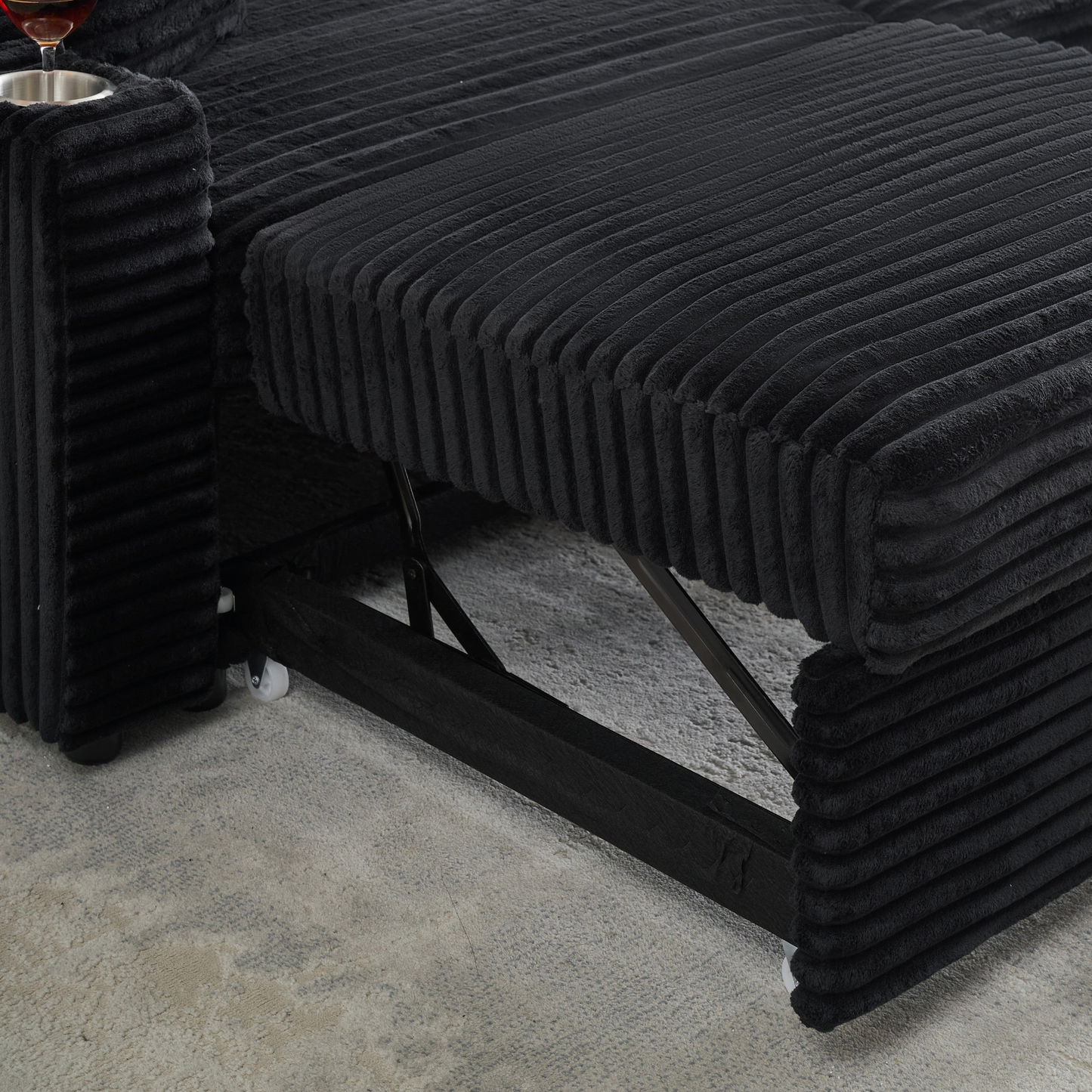 An 80-inch two-in-one pull-out, foldable and hidden chaise longue black corduroy sofa with cup holders and pillows, which is suitable for the living room.